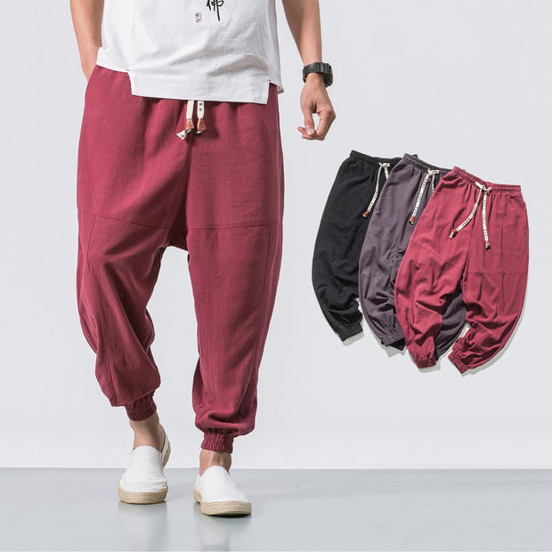 gules Men’s hip hop jogger pants with elastic pockets, tapered style, urban streetwear.