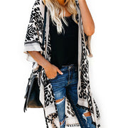 Bali beach resort kimono cardigan in black with boho print and pom-pom detailing