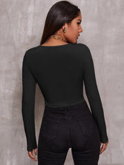 Women’s ribbed front-zip crop top in black back, trendy and fitted.