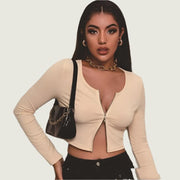 Women’s ribbed front-zip crop top in beige, trendy and fitted.