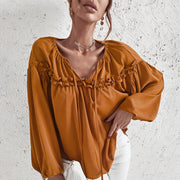 Women’s ruffled V-neck blouse in caramel with boho chic style.