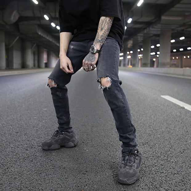 Men’s distressed skinny jeans in grey, perfect for street style.