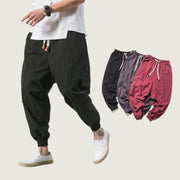 Men’s hip hop jogger pants with elastic pockets, tapered style, urban streetwear.