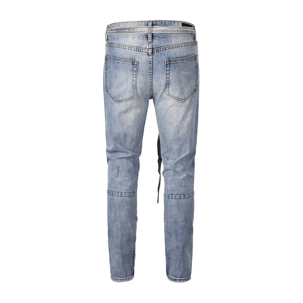 Men’s distressed blue ripped jeans, modern casual style.