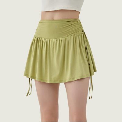 Women’s athletic yoga skirt with adjustable drawstrings in green, lightweight and sporty