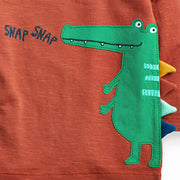 Boys’ knitted cotton t-shirt with crocodile graphic, fun casual wear.