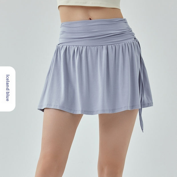 Women’s athletic yoga skirt with adjustable drawstrings in blue, lightweight and sporty