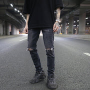 Men’s distressed skinny jeans in grey, perfect for street style.