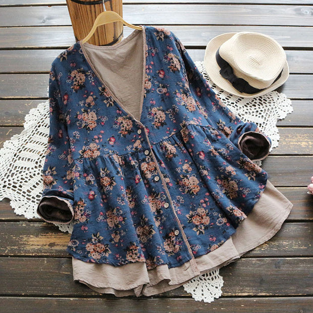 Women’s floral V-neck long-sleeve blouse in blue, elegant and loose fit.