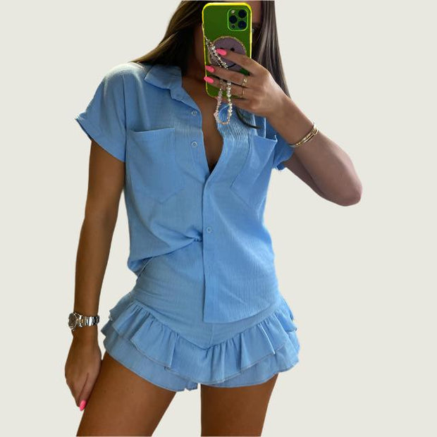 Women’s casual button-down blouse and shorts set in blue, relaxed fit.