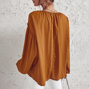 Women’s ruffled V-neck blouse in caramel with boho chic style.